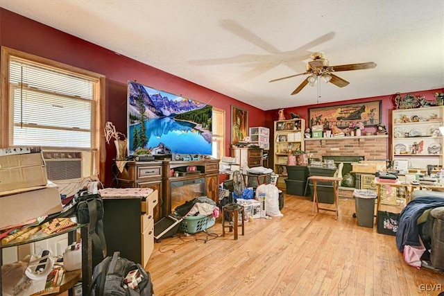 interior space with ceiling fan and light hardwood / wood-style floors