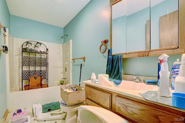 full bathroom with vanity, toilet, and washtub / shower combination