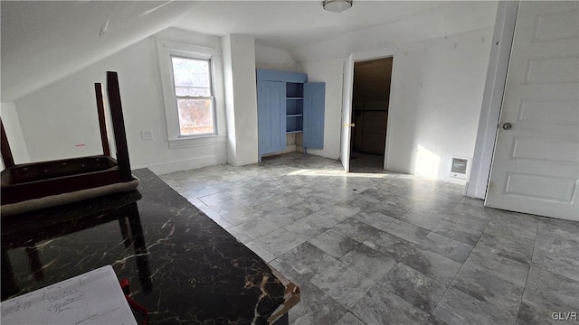 interior space featuring vaulted ceiling