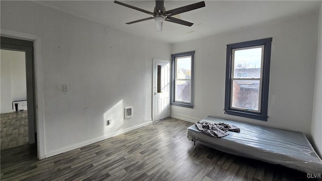 unfurnished bedroom with hardwood / wood-style floors and ceiling fan