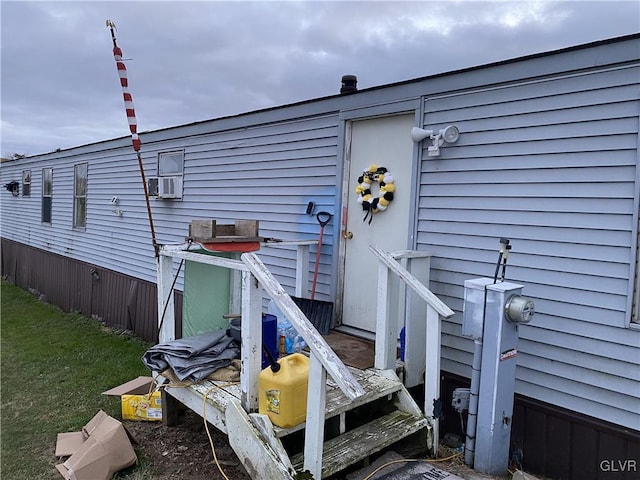 doorway to property featuring cooling unit