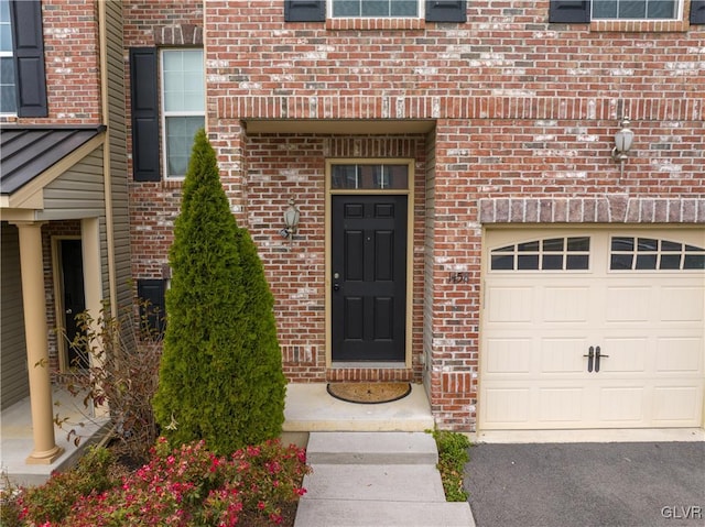 doorway to property featuring a garage