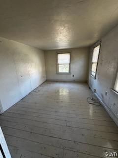 empty room with wood-type flooring