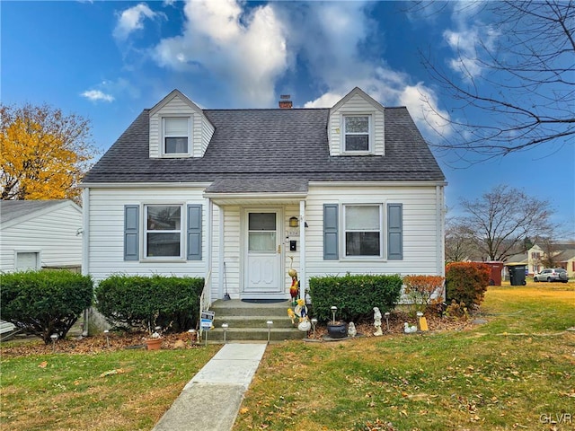 new england style home with a front lawn