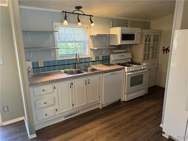 kitchen with sink, decorative light fixtures, white appliances, decorative backsplash, and white cabinets