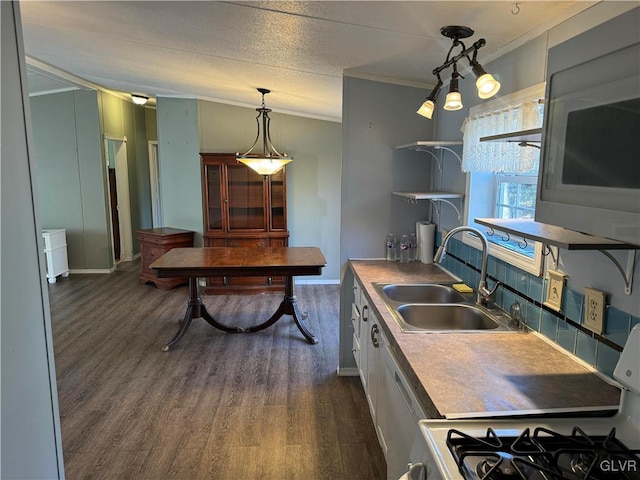 kitchen with white cabinets, crown molding, sink, dark hardwood / wood-style floors, and range