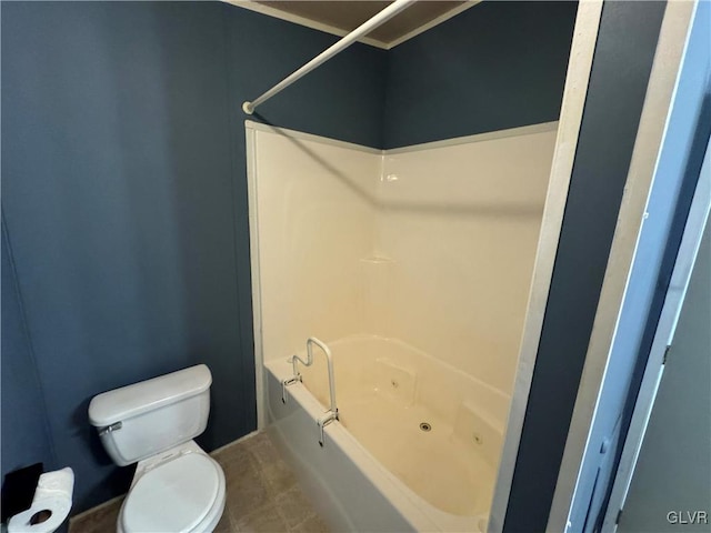 bathroom featuring shower / bathtub combination and toilet