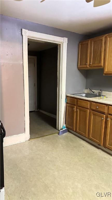 kitchen with ceiling fan and sink