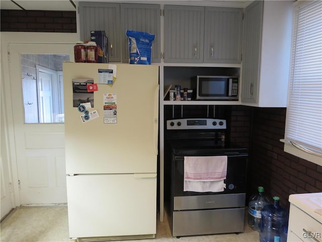 kitchen featuring appliances with stainless steel finishes and gray cabinets