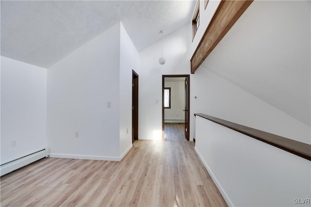 corridor with baseboard heating, beamed ceiling, high vaulted ceiling, light hardwood / wood-style floors, and a textured ceiling