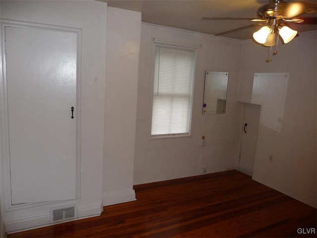 foyer entrance featuring ceiling fan and dark hardwood / wood-style floors