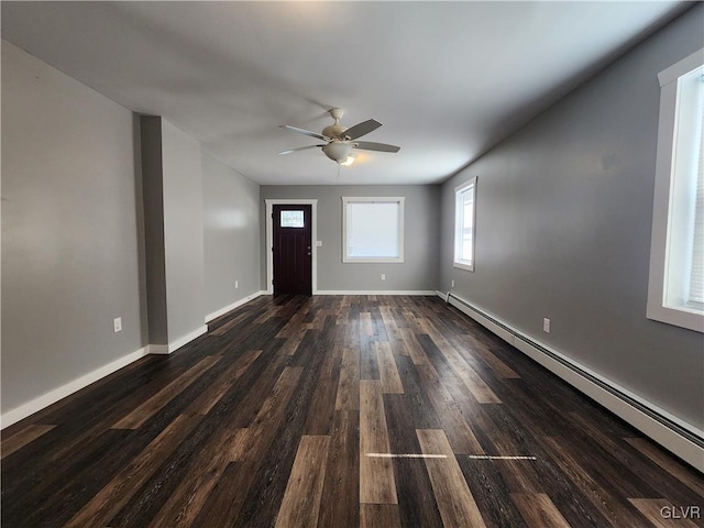 entryway featuring dark hardwood / wood-style floors, ceiling fan, and baseboard heating