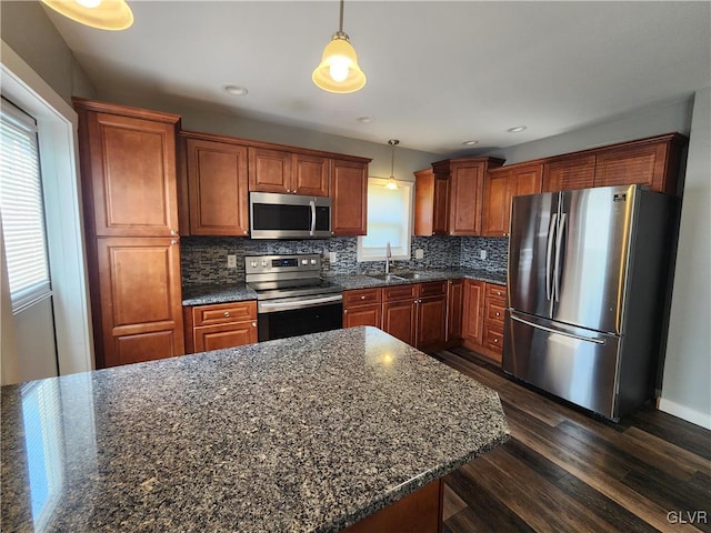 4400 Little Gap Rd, Lower Towamensing Tp, PA 18058 - kitchen with appliances with stainless steel finishes, a sink, dark wood-style flooring, decorative backsplash, and decorative light fixtures