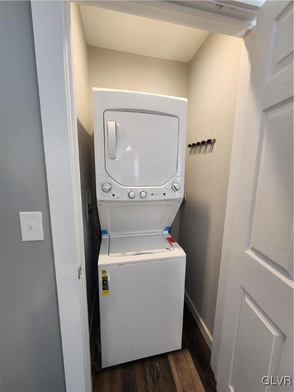 4400 Little Gap Rd, Lower Towamensing Tp, PA 18058 - laundry area featuring stacked washing machine and dryer and dark wood finished floors