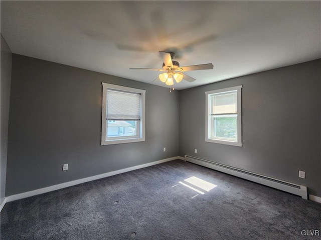 carpeted spare room with baseboard heating and ceiling fan