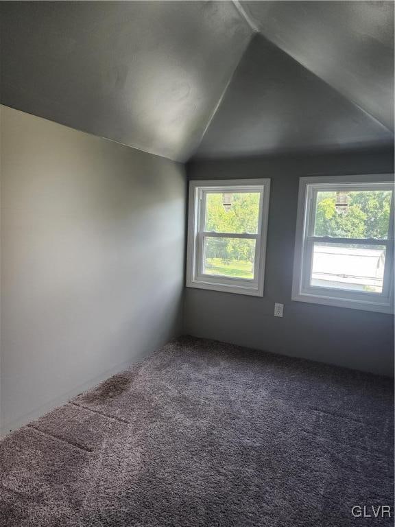 bonus room featuring carpet flooring, plenty of natural light, and vaulted ceiling