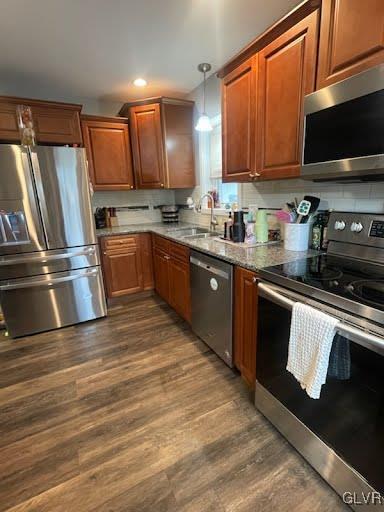 4400 Little Gap Rd, Lower Towamensing Tp, PA 18058 - kitchen with appliances with stainless steel finishes, dark wood-style flooring, a sink, brown cabinets, and recessed lighting
