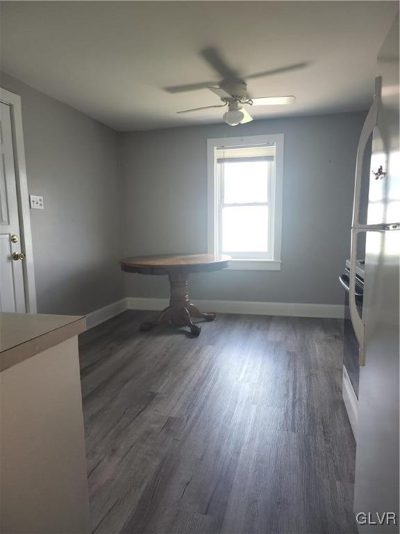 4400 Little Gap Rd, Lower Towamensing Tp, PA 18058 - unfurnished dining area with dark wood-type flooring, a ceiling fan, and baseboards