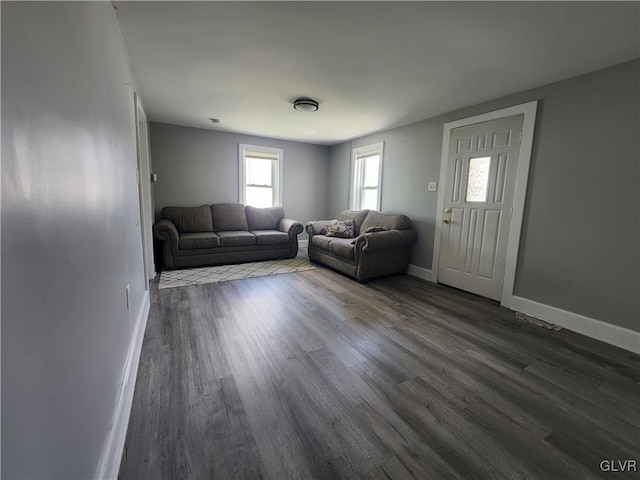 unfurnished living room with dark hardwood / wood-style floors