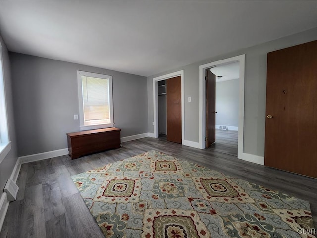 unfurnished bedroom featuring dark wood-type flooring