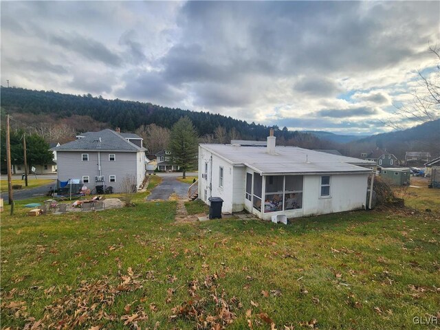 4400 Little Gap Rd, Lower Towamensing Tp, PA 18058 - back of property with a sunroom, a yard, and a chimney