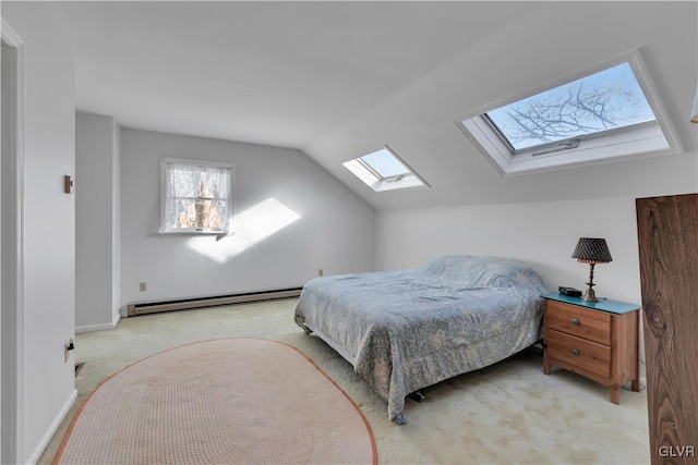 carpeted bedroom with baseboard heating and vaulted ceiling with skylight