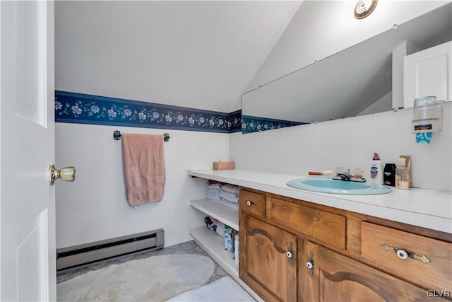 bathroom with vanity, a baseboard radiator, and vaulted ceiling