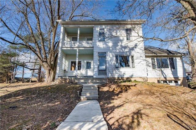 view of front of property with a balcony