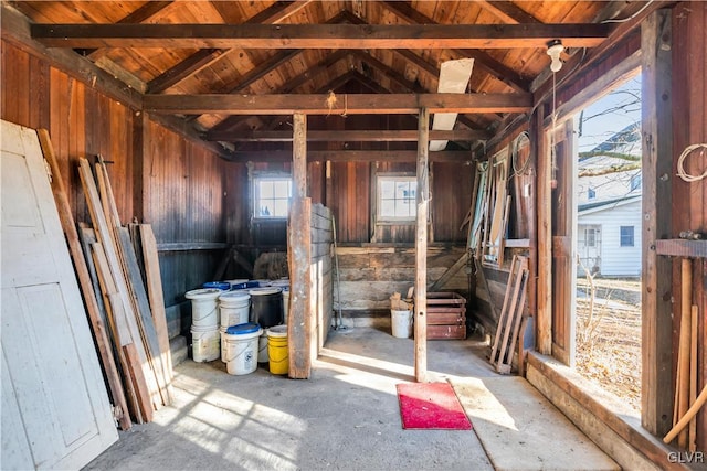 misc room with a healthy amount of sunlight and vaulted ceiling