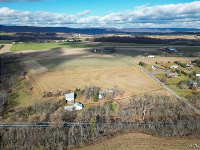 birds eye view of property featuring a mountain view and a rural view