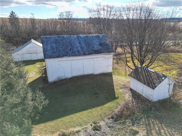 view of outdoor structure with a lawn