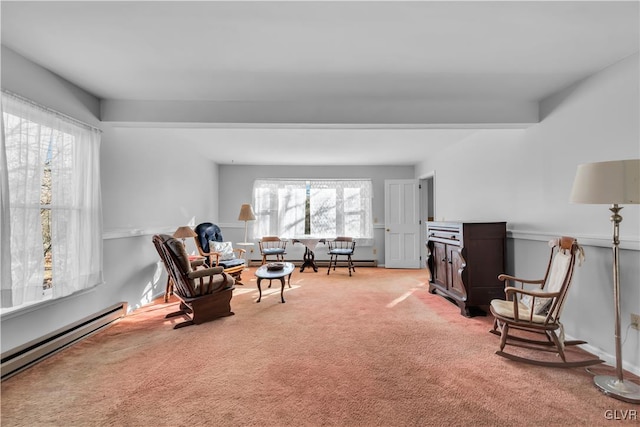 living area with beamed ceiling, light colored carpet, and baseboard heating