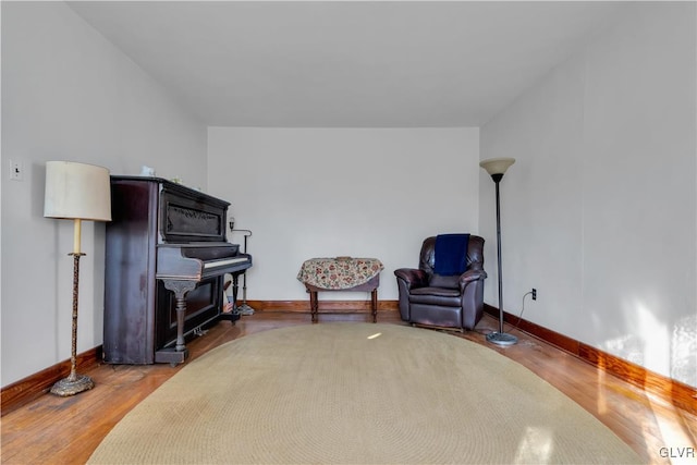 sitting room with hardwood / wood-style flooring