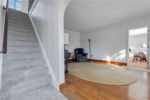 stairway featuring hardwood / wood-style flooring