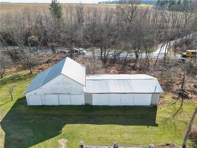 view of outdoor structure featuring a lawn