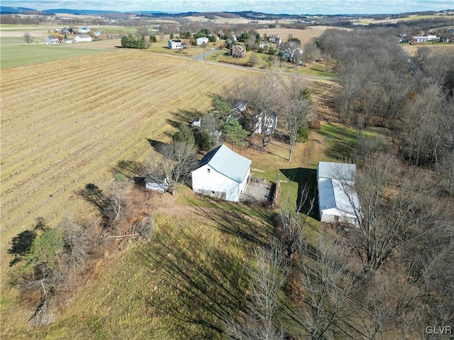 birds eye view of property featuring a rural view