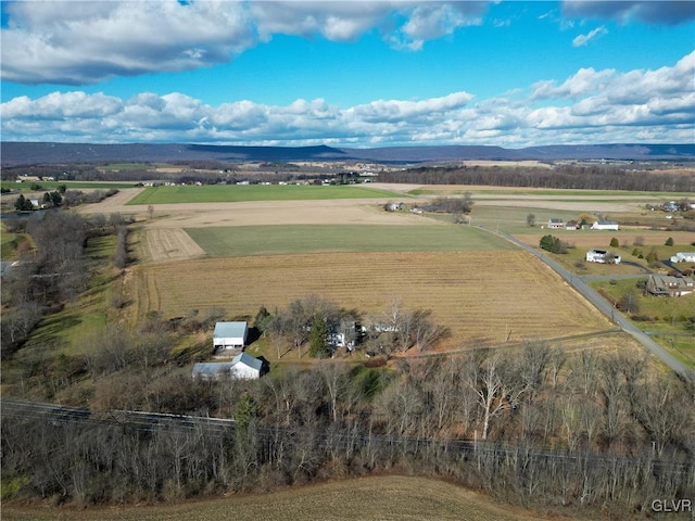 drone / aerial view featuring a mountain view and a rural view