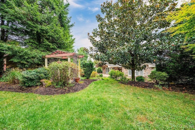 view of yard with a pergola