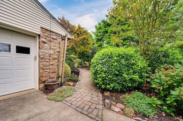 view of yard featuring a garage