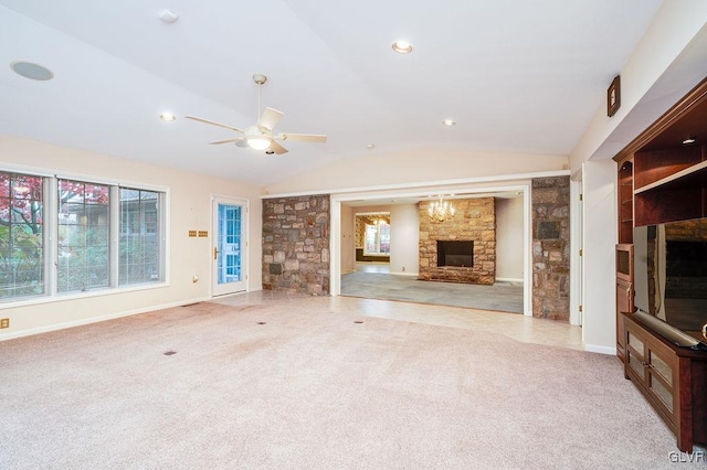 unfurnished living room with a stone fireplace, light carpet, ceiling fan, and vaulted ceiling