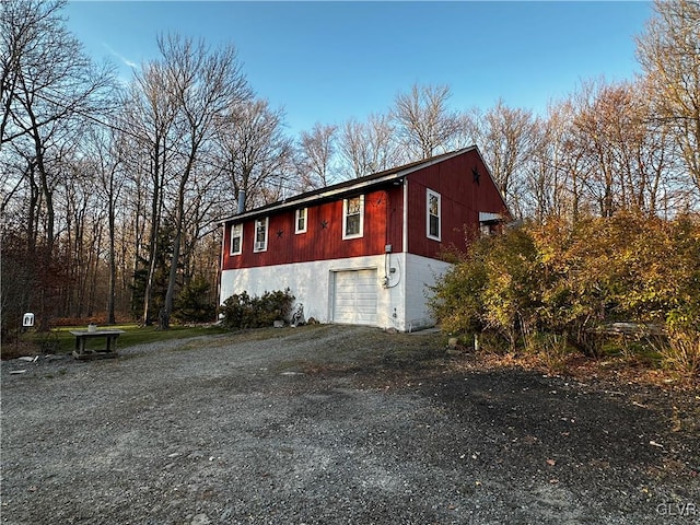 view of side of property featuring a garage