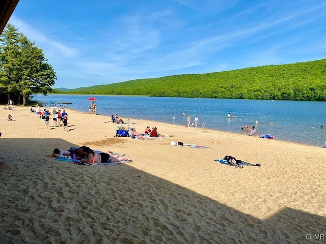 property view of water featuring a beach view