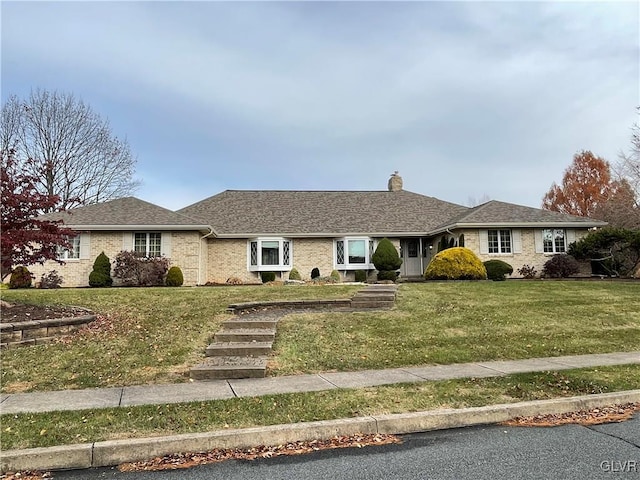 ranch-style house featuring a front lawn