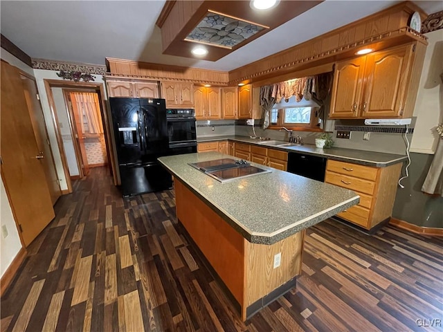 kitchen with sink, a kitchen island, black appliances, and dark hardwood / wood-style floors