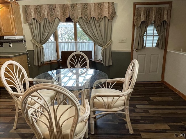 dining room with dark wood-type flooring