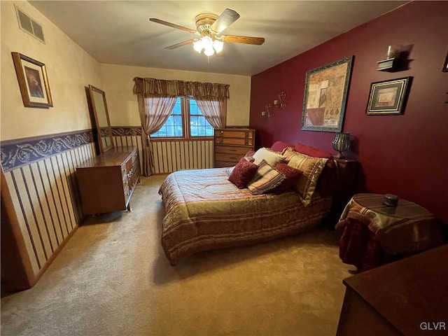 bedroom featuring ceiling fan and light colored carpet