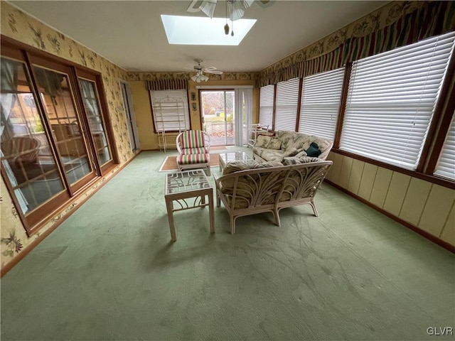 sunroom / solarium with a skylight and ceiling fan