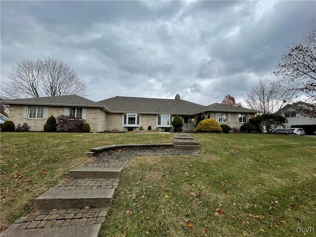 ranch-style house with a front lawn