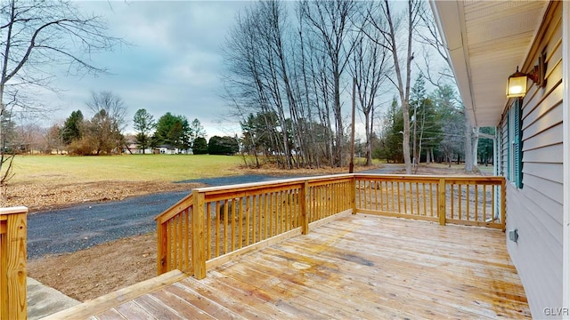 wooden terrace with a yard