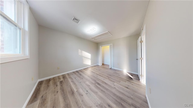 unfurnished room featuring light wood-type flooring